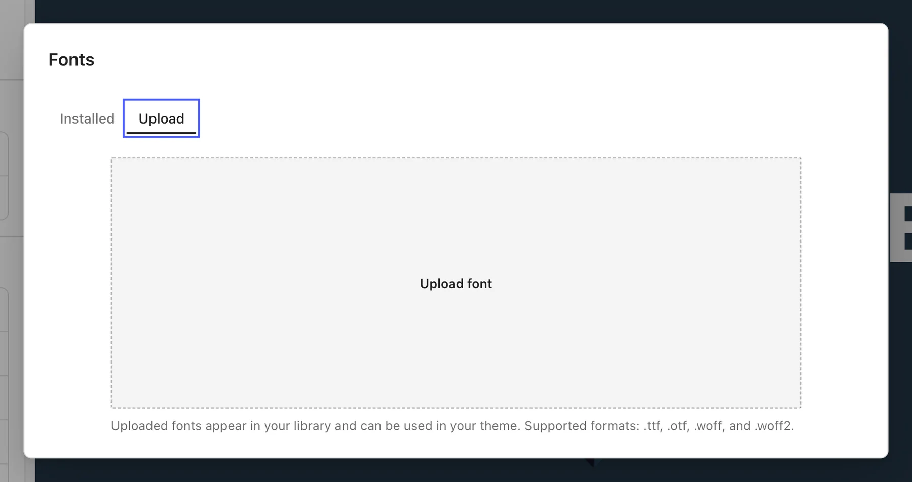 Fonts dialog with the Upload tab selected and an empty drop area for font files